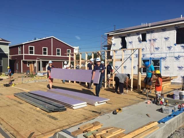 Personal Asset associates volunteer at a construction site