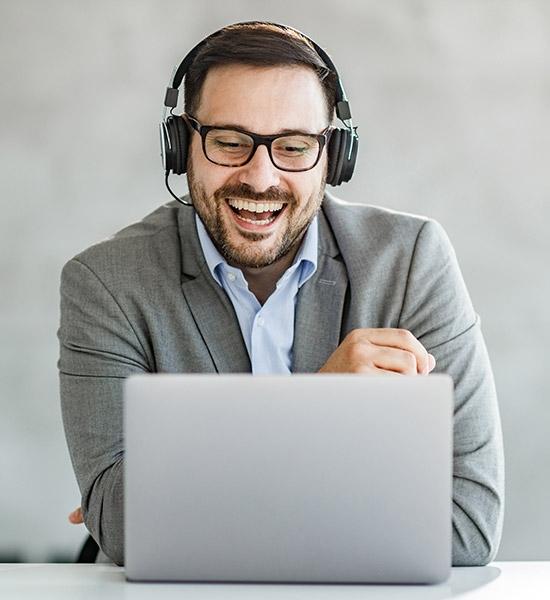 A financial support representative speaking on headset at home office