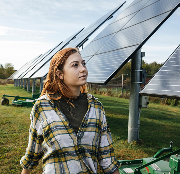 Woman standing in front of solar panels